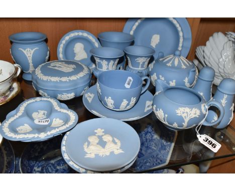 A GROUP OF WEDGWOOD BLUE JASPERWARE, comprising a cup and saucer, cream jug, salt and pepper pots, a covered sugar bowl, four