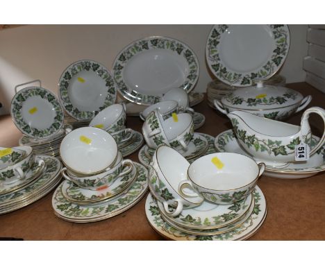 A WEDGWOOD 'SANTA CLARA' PATTERN DINNER SET, comprising a twin handled covered tureen, three oval meat plates, fourteen dinne