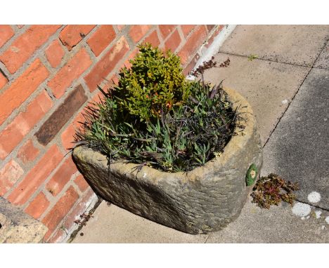 A VINTAGE SANDSTONE TROUGH with one curved end width 43cm depth 54cm  height 28cm with soil and planting( this lot is not sol