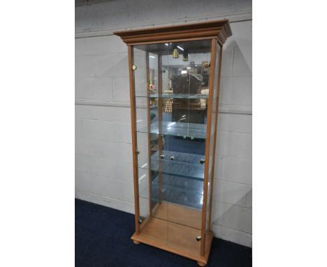 A MODERN BEECH TWO DOOR DISPLAY CABINET, fitted with a single light, width 64cm x depth 32cm x height 181cm, (condition:- som