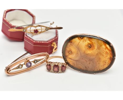 THREE EARLY 20TH CENTURY BROOCHES AND A 9CT GOLD RING, the first an oval cut agate prong set in a rose metal mount, fitted wi