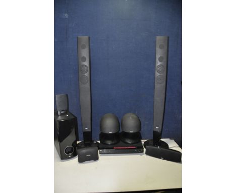 A LG SPEAKER SYSTEM comprising a part of an LG SH53PH-F floor standing speakers, a single SH52PH-C centre speaker, LG SH53PH-