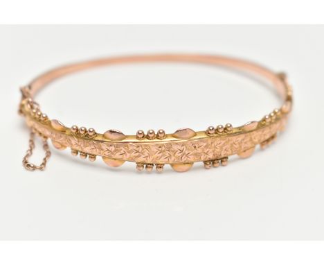 A 9CT GOLD HINGED BANGLE, with ivy leaf pattern and applied bead work surround, Sponsors mark 'S&amp;P', hallmarked 9ct Birmi