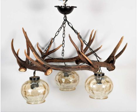 Antler Furniture: Antler Mounted Chandelier, circa late 20th century, an antler mounted three-light chandelier, formed with s
