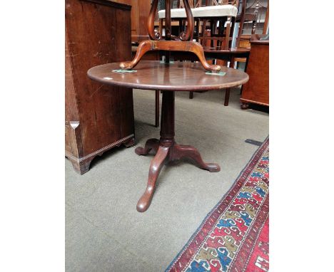 A George III Oak Tilt Top Tripod Table, with gun barrel support, 86cm by 70cm