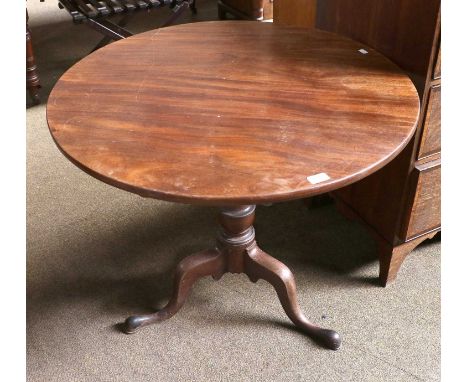 A George III Tilt Top Mahogany Tripod Table, with urn form support on pad feet, 86cm diameter by 70cm