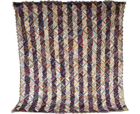 Circa 1890 Silk Log Cabin Quilt, incorporating multi coloured silk patches, within a silk scalloped border, backed by a print