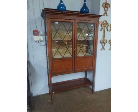 An Edwardian Inlaid Mahogany Glazed Display Cabinet, with shelf stretcher, 107cm by 44cm by 178cm