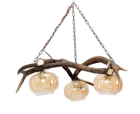 Antler Furniture: Antler Mounted Chandelier, circa late 20th century, an antler mounted three-light chandelier, formed with t