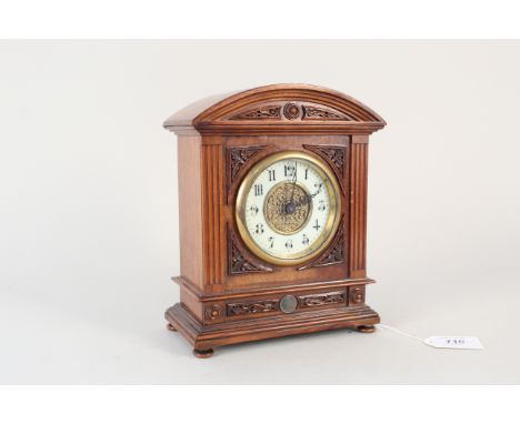 An Edwardian rosewood porcelain and gilt dial mantel clock