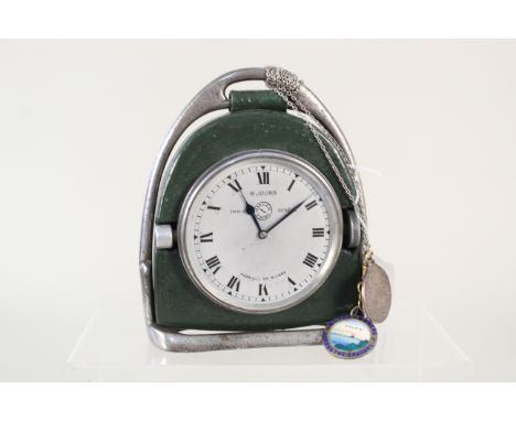 A Jaeger travelling clock in a stirrup case with two medallions