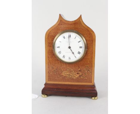 A 19th Century mahogany cased John Walker Ltd mantel clock, brass feet with musical inlay to front, marked 'To the King' '63 