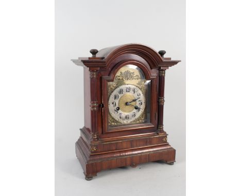 An Edwardian walnut cased mantel clock