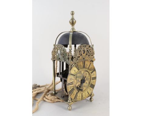 An antique brass lantern clock of mid 17th Century design, signed 'R Fox Harbro', 15 1/2" high