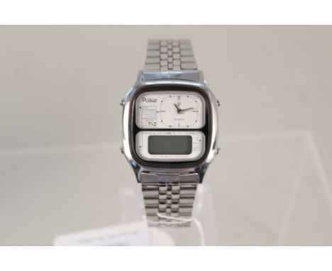 A Pulsar quartz Y651-5060 stainless steel dual time watch, with original box and manual