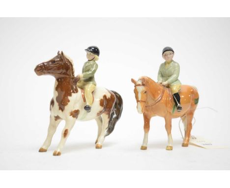 A pair of Beswick pony club figures, modelled as a boy and girl on horseback, each with printed mark, one with sticker, 14.5c