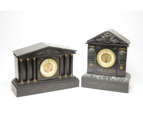 A Victorian black slate mantel clock, the architectural case with central white enamel Arabic dial, flanked by female faces i
