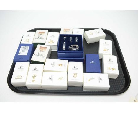 A collection of Swarovski Crystal Memories Classics decorative items, including: camera; telephone; clock; tricycle; and othe
