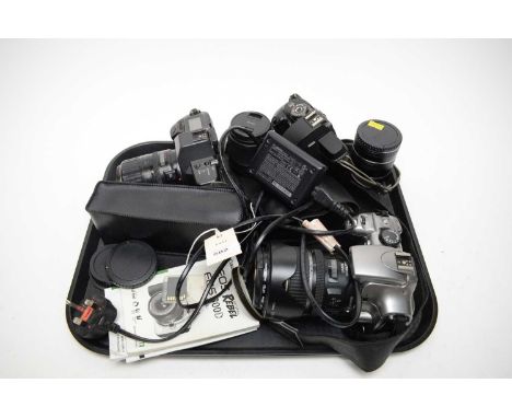 A collection of Canon EOS cameras, including: Canon EOS 600 camera; Canon EOS 5000 camera; and another; together with associa