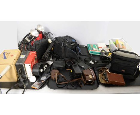 A collection of camera equipment and accessories.