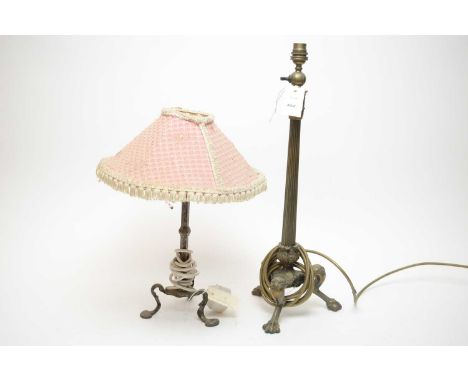 A Victorian cast brass table lamp, the tapering column support raised over stylised legs with paw feet, 53cms high; together 