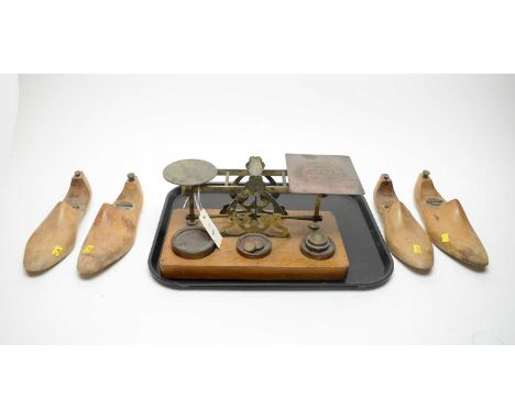 A set of brass postal scales, by S. Mordan &amp; Co, London, with weights; together with four vintage shoe lasts or stretcher