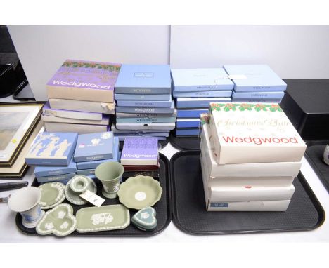 A collection of Wedgwood Jasperware, including: Christmas Plates and other plates, many boxed; vases; candlestick; pin dishes
