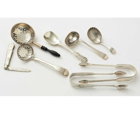 A selection of silver items to include a good quality George III caddy spoon by Samuel Atkins, London 1815; a sugar sifting s