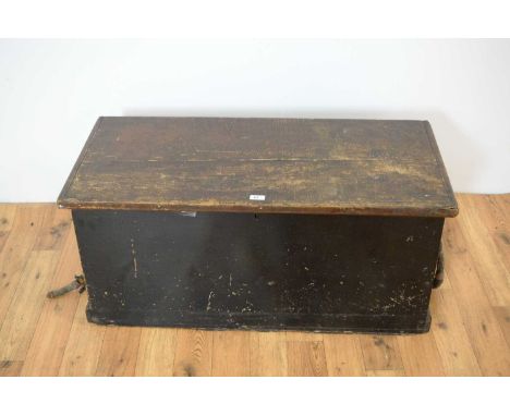 An early 20th Century ebonised pine carpenters tool chest, the hinged lid opening to reveal a hand painted maritime scene of 
