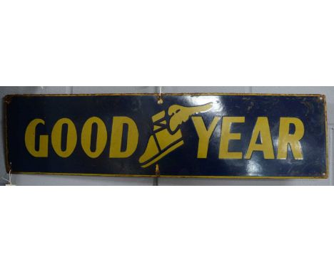 A Good Year enamel advertising sign, of rectangular sign, inscribed ‘Good Year’ with central logo, 20.5 x 80.5cms wide. 