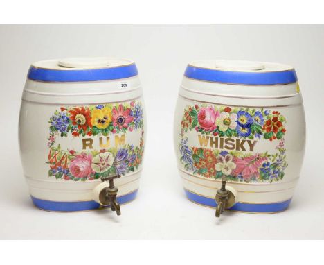 A 19th Century style ceramic whisky barrel, with floral decoration, brass tap, 33cms high; and a similar Rum barrel. (2)