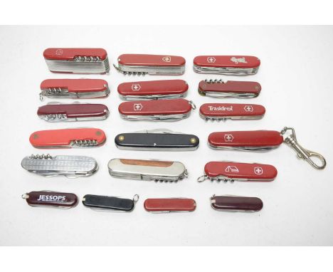 A collection of Swiss Army and other similar folding utility knives.
