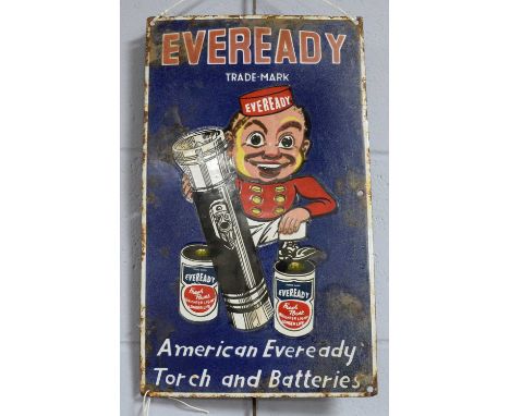 An Eveready enamel advertising sign, of rectangular form, with figural decoration and motto ‘American Eveready Torch and Batt