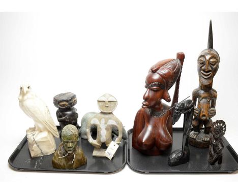 A collection of carved sculptures, including: tribal carved wood figure of a man, 54cms high; Aboriginal Australian carved wo