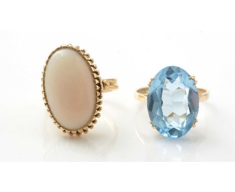 A light blue paste ring on 9ct yellow gold shank, ring size P, 5.4g gross; together with a Coral ring in 18ct yellow gold mou