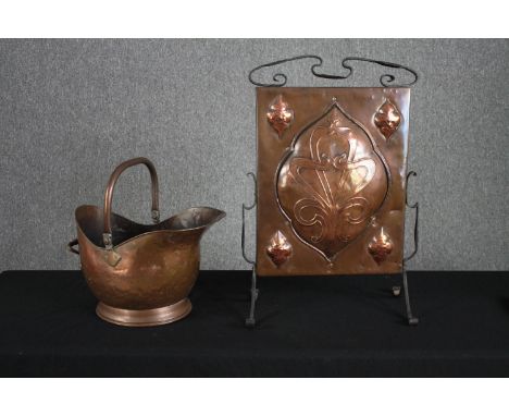 An iron framed Arts and Crafts copper fire screen and a copper coal bucket. H.70 W.45cm. (largest) 
