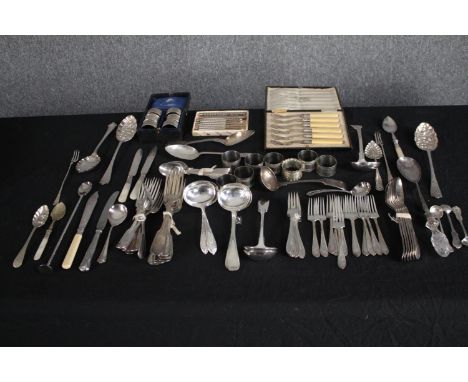 A mixed collection of silver plated cutlery and flatware including napkin rings and ladles. L.26cm. (largest) 