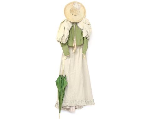 Late Victorian early 20th century skirt ensemble with the short fitted jacket in pale and olive green with leg of mutton slee