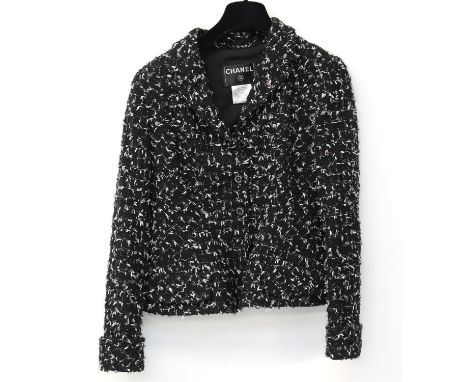 Chanel suit Autumn 2006 marked size 38 black ground with white, pink and green highlights and flecked with silver threads, ty
