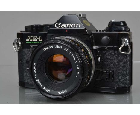 A Canon AE-1 Program SLR Camera, black, shutter working, meter working, camera responsive in program, self timer working, bod