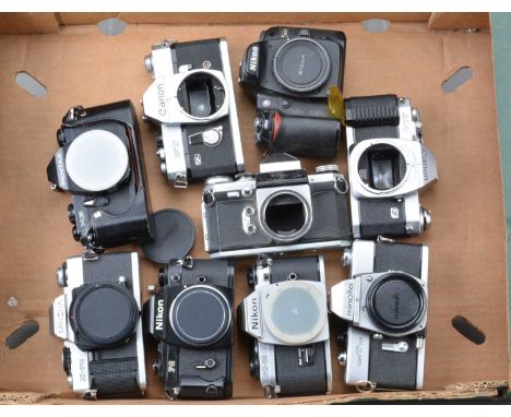 A Group of SLR Camera Bodies, a Nikon FG, FG-20, both with shutter button/winder damage, Canon FT QL, shutter sticking in one