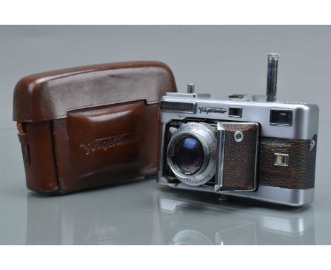 A Voigtländer Vitessa L Rangefinder Camera, shutter working, light cell responsive, rangefinder working, body G, some fading 