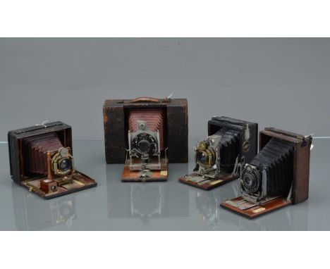 Four Folding Bed Cameras, an Ensign Model D, Ensign Tudor London Stereoscopic 3 x 4'' and a 3 x 4.5'' folding bed camera, all