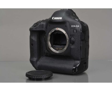 A Canon EOS-1D DSLR Camera Body, shutter fires, ERR 20 code showing in display, body G, light scratches to top, with battery 