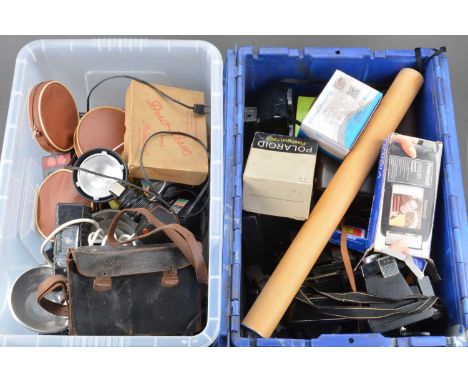 Two Boxes of Camera Related Items, including Polaroid cameras, Polaroid out of date film, flash units, flash bulbs and other 
