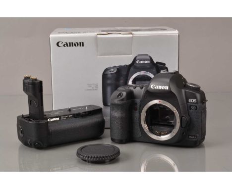 A Canon EOS 5D Mark II DSLR Camera Body, shutter working, appears to function as should, body G-VG, with battery. Charger, bo