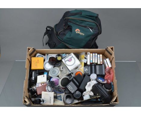A Tray of Camera Related Accessories,  including filters, flash units, light meter, projector bulbs, drive and other items