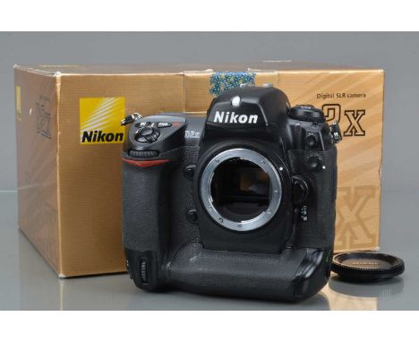 A Nikon D2X DSLR Camera Body, serial no 5041779, powers up, shutter working, appears to function as should, body G, light wea