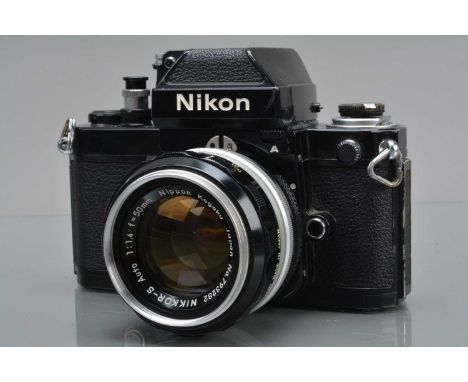 A Nikon F2 Photomic A SLR Camera, black, serial no 7451994, shutter working, self timer working, finder responsive, body G, s