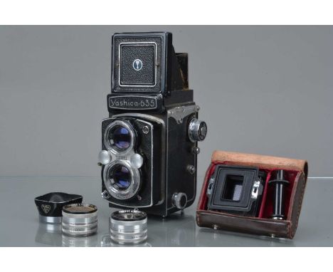 A Yashica 635 TLR Camera, shutter working, self timer working, body F-G, name plate loose, some paint scratches to edges, wit